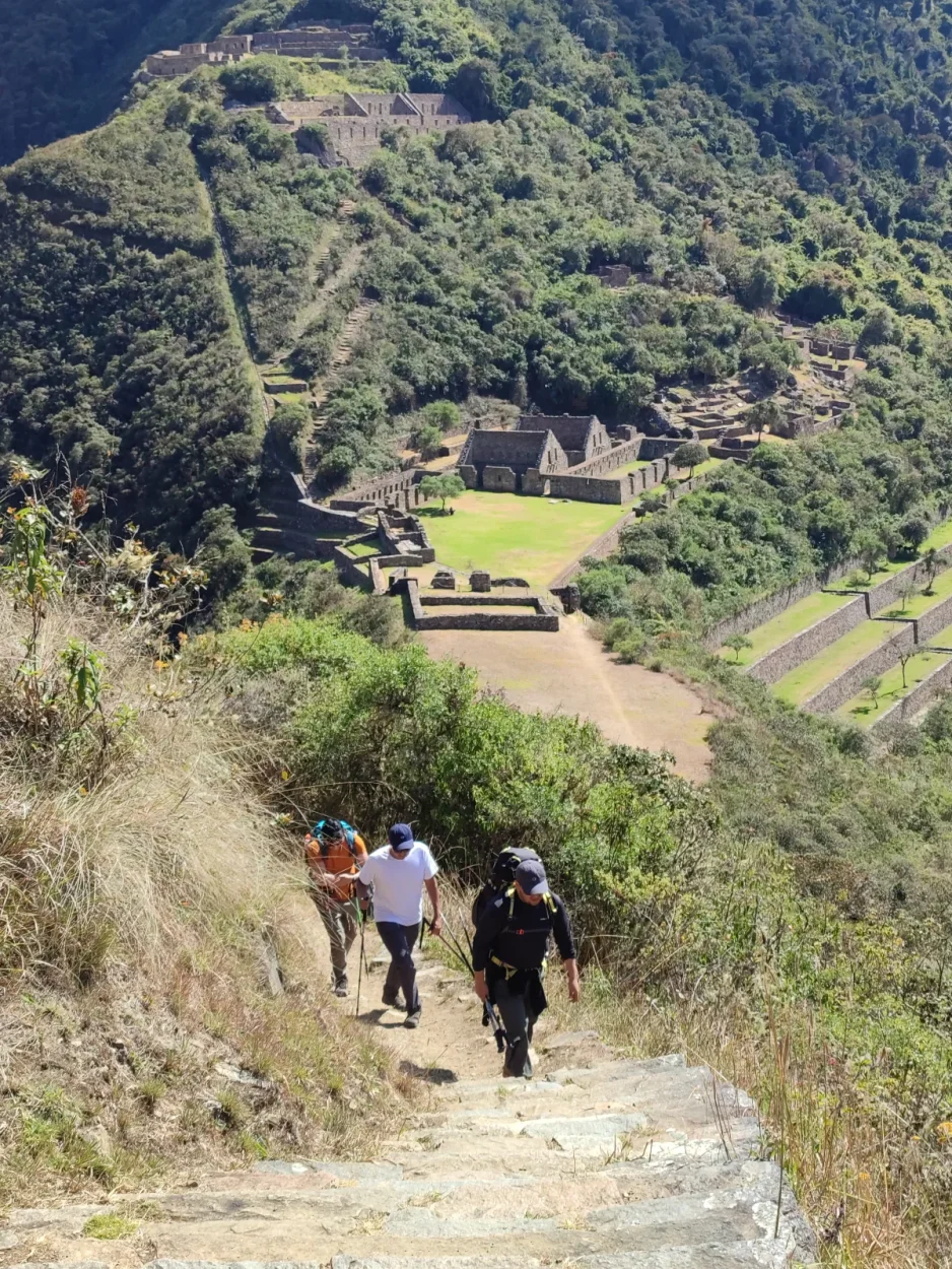 Hikers on the stone path arriving at Choquequirao