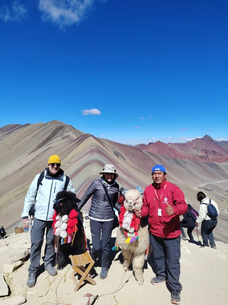 Juan (in red) with travelers at the Rainbow Mountain (Vinicunca) viewpoint