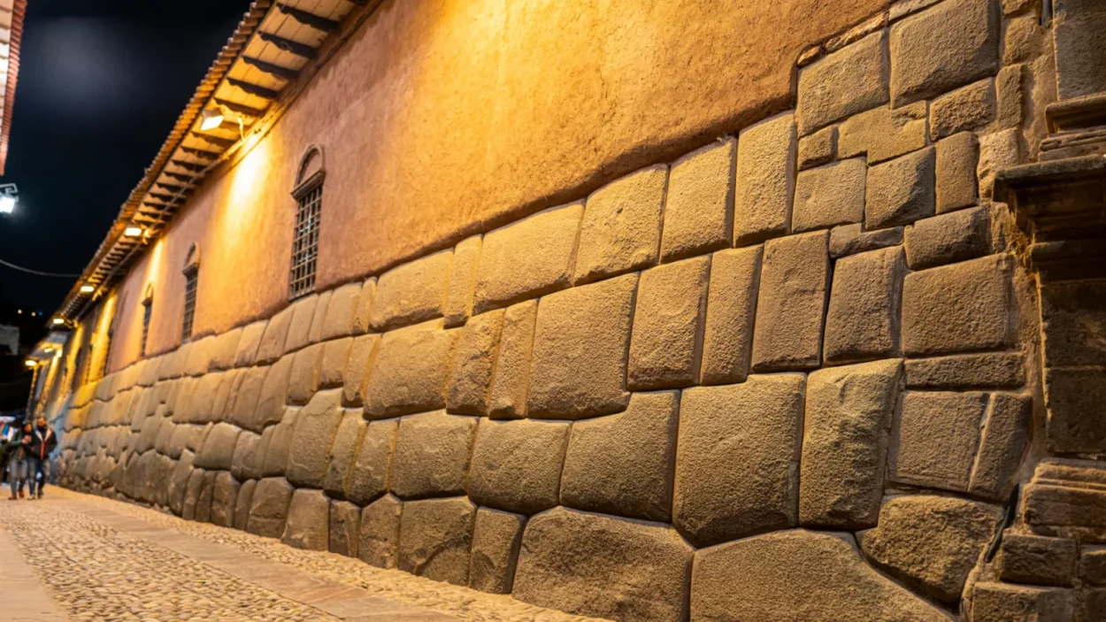 Inca stone wall on Hatun Rumiyoc street in Cusco at dusk