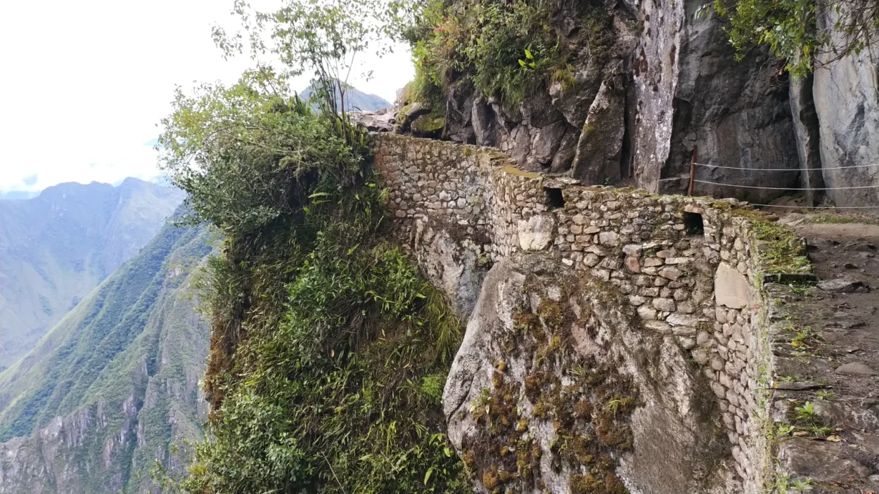 The Inca Bridge trail cut into a cliff at Machu Picchu