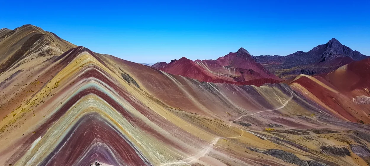 Panoramic view of Rainbow Mountain and the red mountains around it