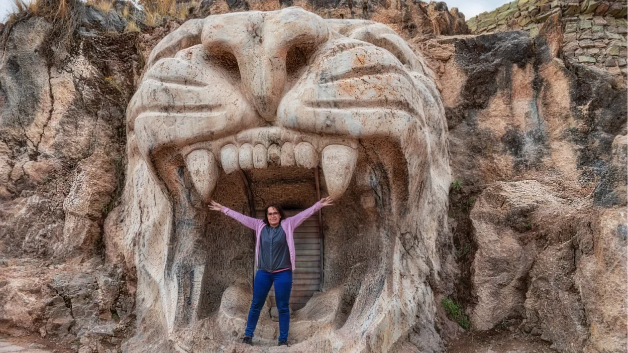 Traveler inside the puma head sculpture at the Abode of the Gods (Apukunaq Tianan), Cusco